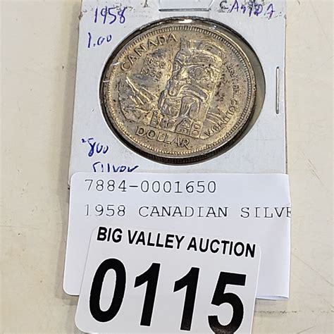 1958 CANADIAN SILVER DOLLAR - Big Valley Auction