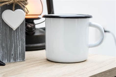 Premium Photo | Enamel white coffee and tea mug