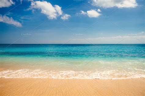 Colorful sea view from tropical wahite sand beach with sunny blue sky in Bali. Summer daylight ...