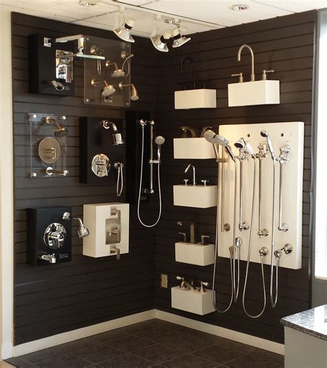 Shower corner featuring California Faucets, Lacava, and Jewel fixtures on display at Best Plumbi ...