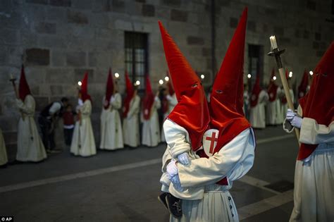 Holy Week procession in Spain sees thousands of penitents fall silent ...