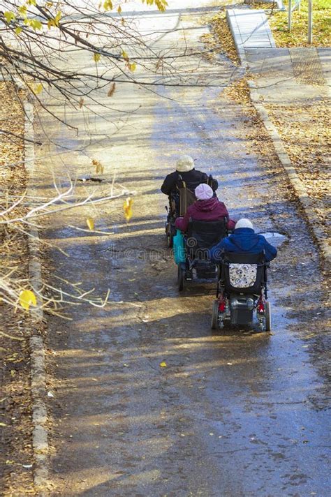 A Company of Disabled Elderly Women in Self-propelled Electric ...