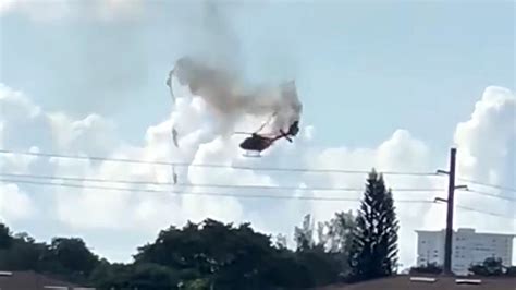 Two dead and four injured as rescue helicopter bursts into flame in midair and plummets to ...