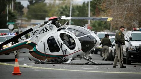 Las Vegas helicopter crashes into residential street, 2 police officers injured | CBC News