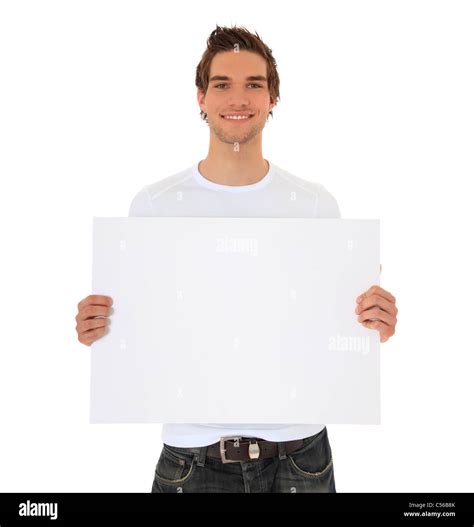 Attractive young man holding blank sign. All on white background Stock Photo - Alamy