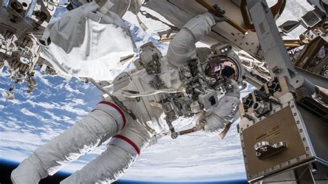 Astronauts perform successful spacewalk to set up TV cameras for arriving spacecraft | CBC News