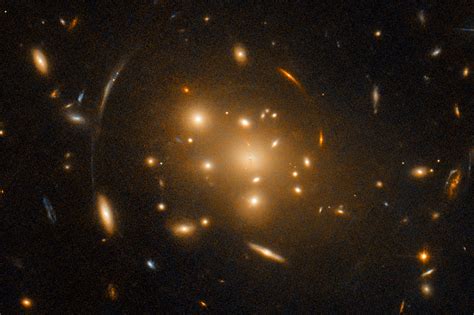 Hubble Space Telescope Observes Large Galaxy Cluster Contorted by ...