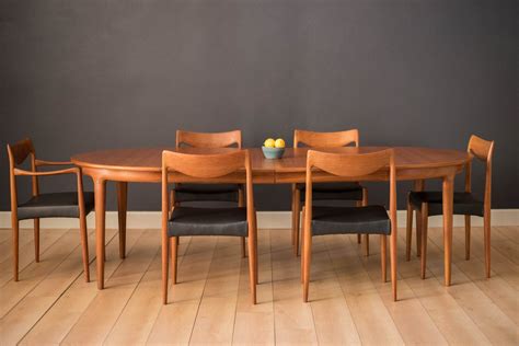 Vintage Round Danish Expandable Teak Dining Table by Johannes Andersen - Mid Century Maddist