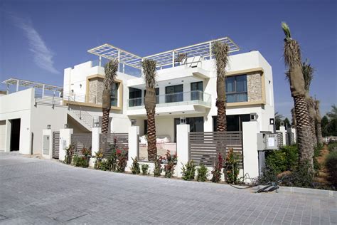 Sustainable Townhouse villas in The Sustainable city in Dubai. Rooftops ...