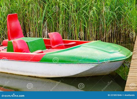 Boat pedalo on lake shore stock photo. Image of boat - 221851846