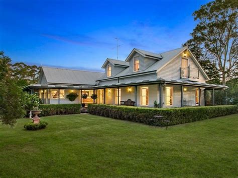 Country home with dormers and wrap around verndah with bullnose ...