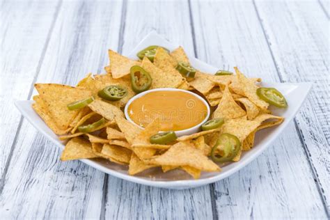 Nachos with Cheese Dip stock photo. Image of sauce, crunchy - 59449052