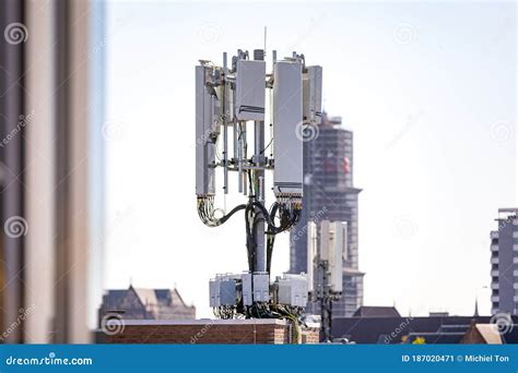 5g Mobile Tower Installation With A Clear Sky In The Background And The Dom Tower Of Utrecht ...