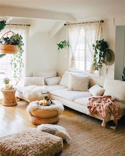 Cream colored living room with brown rattan rug plants cream couch || #livingr | Bohemian living ...