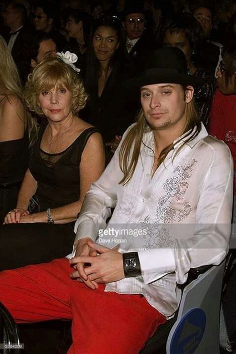 two people sitting next to each other in front of an audience at a ...