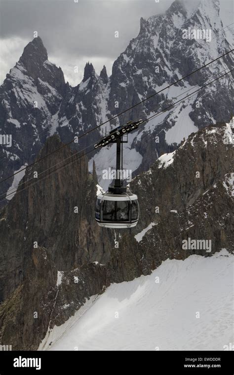 Courmayeur, Italy, 23rd June 2015. A gondola of the Skyway cable car passes in front of Aiguille ...