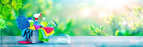 Bucket Of Cleaning Supplies On Wooden Table With Fresh Spring ...