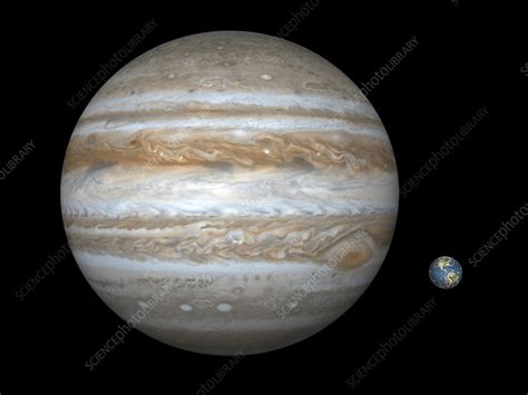 Jupiter and Earth compared, artwork - Stock Image - C006/6376 - Science Photo Library