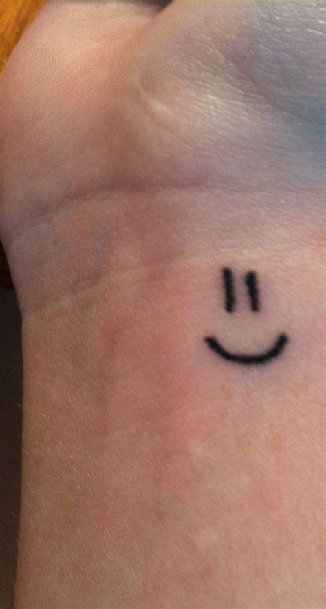 Smiley face wrist tattoo | Smiley face tattoo, Face tattoos, Inner lip tattoo