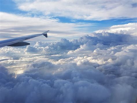 View from Plane Above Clouds Stock Photo - Image of sunlight, cumulus ...