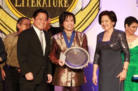 Peter Solis Nery (center) receives the Palanca Hall of Fame award during the 62nd Carlos Palanca ...