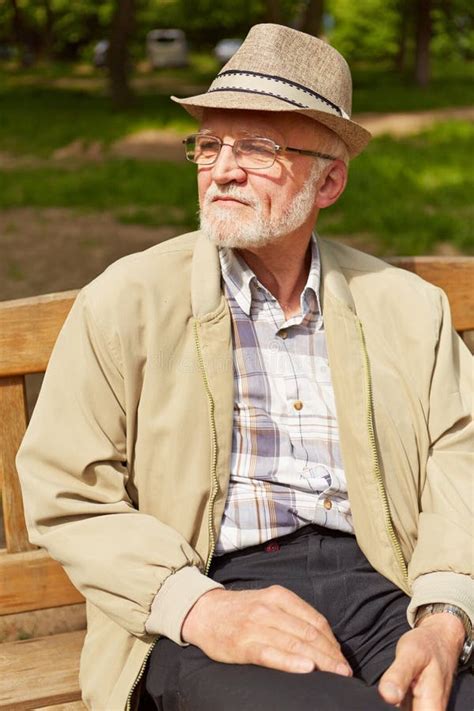 Old Man Sitting On Park Bench