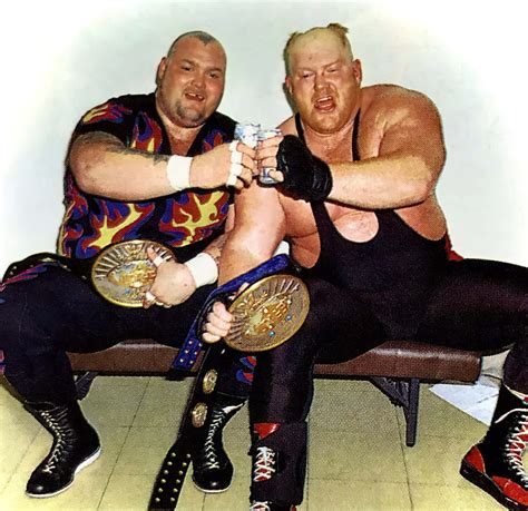 Download Caption: Bam Bam Bigelow and Big Van Vader Celebrating Victory Wallpaper | Wallpapers.com