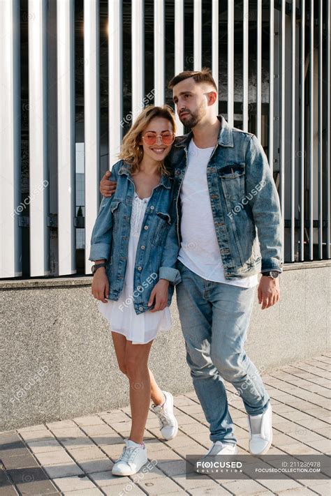 Young adult couple wearing casual clothing strolling outdoors — style, woman - Stock Photo ...