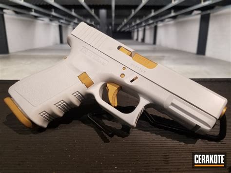 Glock 19 Handgun done in H-140 Bright White and H-122 Gold by WEB USER | Cerakote