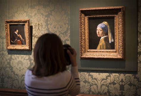 A Climate Activist Just Superglued His Head to Vermeer's 'Girl With a ...