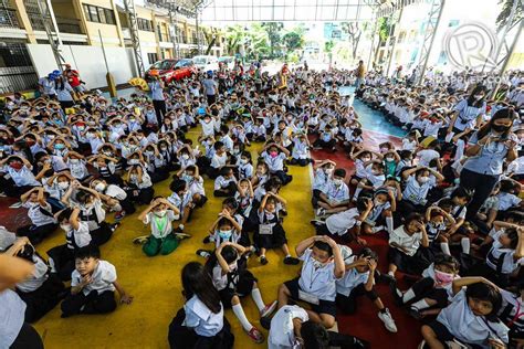 LOOK: Students practice the duck, cover, and hold maneuver as they participate in the Nationwide ...