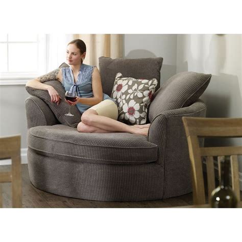 Perfect in corners, this oversized round nest chair features ample cushions, two distinctive ...