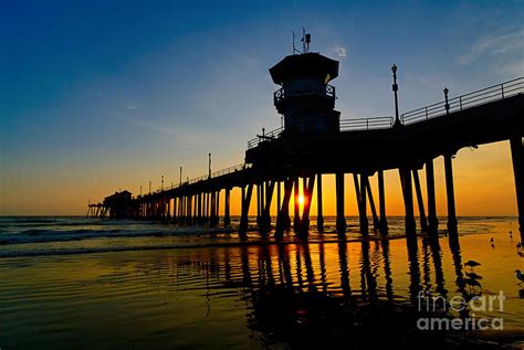 Huntington Beach Pier at sunset Photograph by Jamie Pham