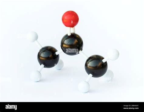 Ball-and-stick-model of an acetone molecule (chemical formula (CH3)2CO) on a white background ...