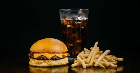 Burger and French Fries Served in a Restaurant · Free Stock Photo