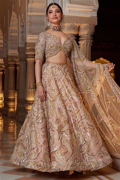 Tamannaah Bhatia wore a nude lehenga with multicoloured embroidery for ...