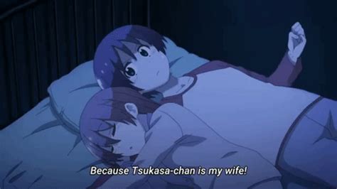 an anime character laying in bed with the caption because tsukasa - chan is my wife