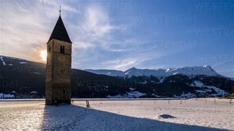 Timelapse of sunset over lake Reschen in winter stock photo