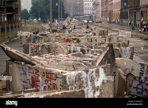 Dismantled pieces of Berlin Wall are piled up to be removed on 11 Stock ...