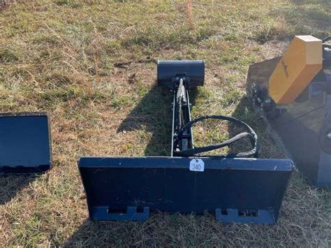 Skid Steer Backhoe Attachment - Potts Brothers Land & Auction