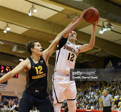 Austin Reaves of the Wichita State Shockers shoots the ball as he is ...