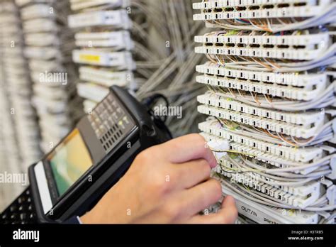 Technician using digital cable analyzer Stock Photo - Alamy