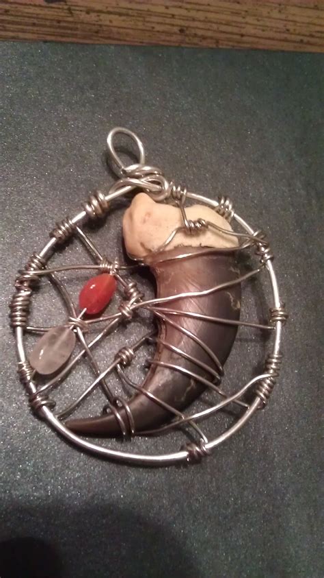 Wire wrap pendant made with Black Bear claw in 2024 | Bear claw necklace, Wire wrapped pendant ...