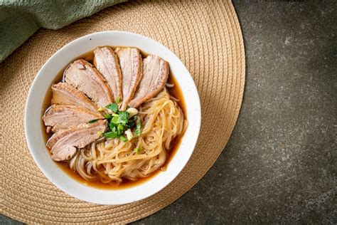 Premium Photo | Duck noodles with stewed duck soup