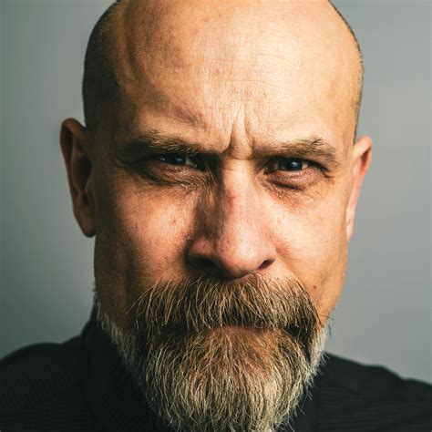 Bald Man with a Serious Facial Expression · Free Stock Photo