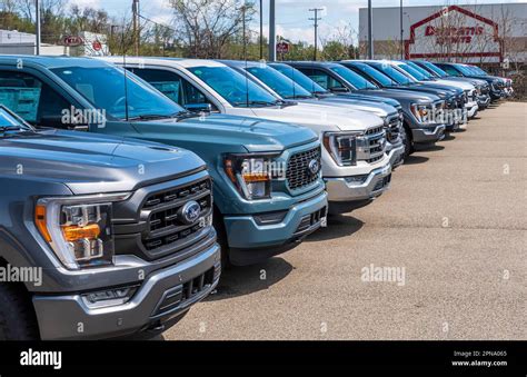 A line of new Ford F150 pickup trucks for sale at a dealership in Monroeville, Pennsylvania, USA ...