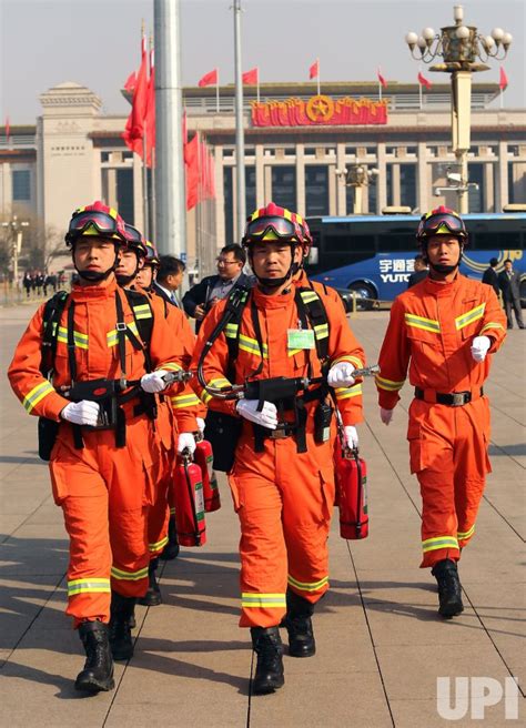 Photo: Chinese firefighters patrol Tiananmen Square for the CPPCC in Beijing, China ...