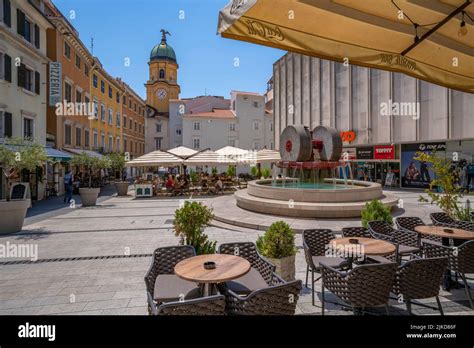 View of City Clock Tower and restaurants in Trg Ivana Koblera in old ...