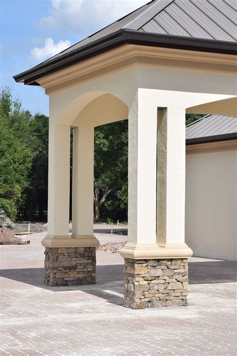 Elegant Arched Portico with Stacked Stone Base and a Standing Seam ...