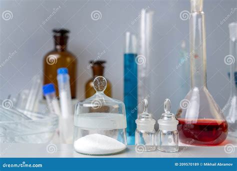 Flasks with Chemical Powder, Laboratory Glassware with Solutions on the ...